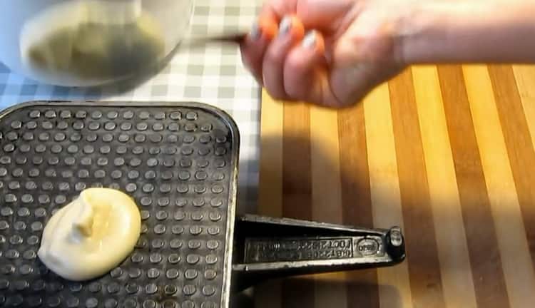 To make wafer rolls with condensed milk, prepare a waffle maker