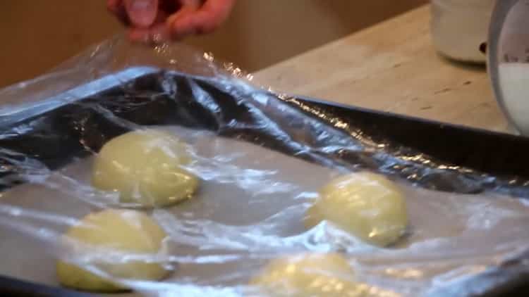 To make burger rolls, prepare a baking sheet