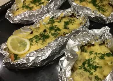 Tasty pink salmon baked with potatoes in foil in the oven