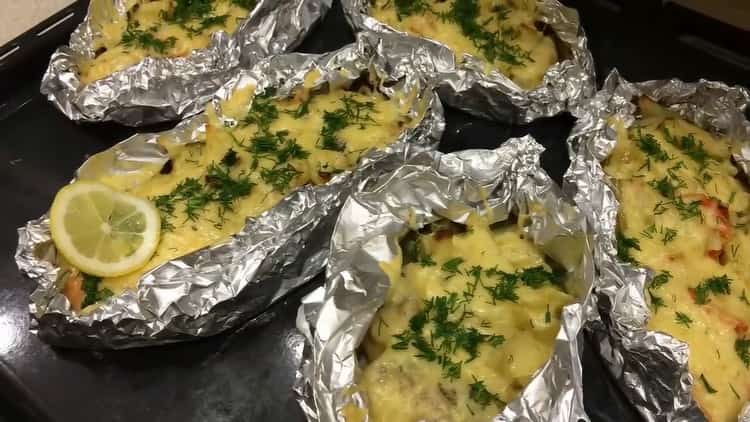 pink salmon in the oven with potatoes in foil is ready