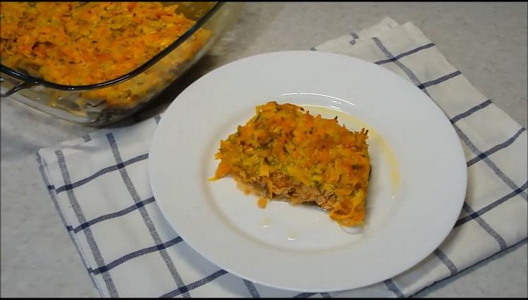 pink salmon in the oven with onions and carrots is ready