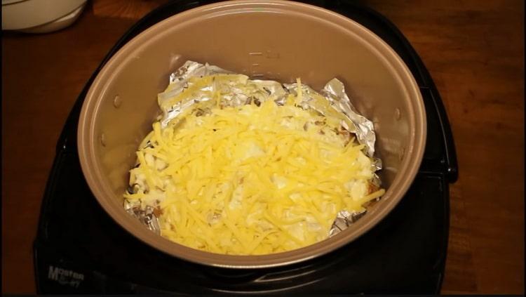 To cook pink salmon in a slow cooker, grate cheese