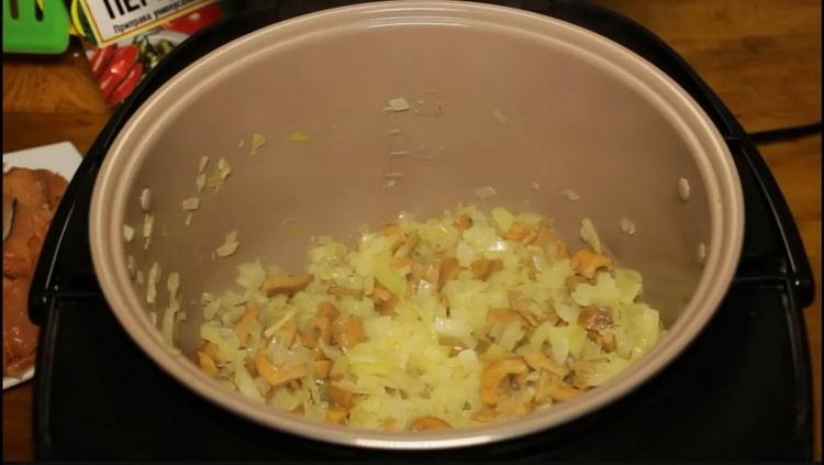 To cook pink salmon in a slow cooker, fry the onion with mushrooms