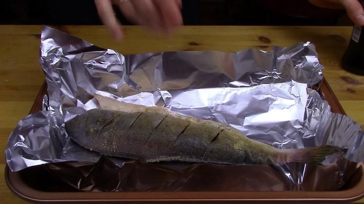 To cook the whole pink salmon in the oven, prepare the foil