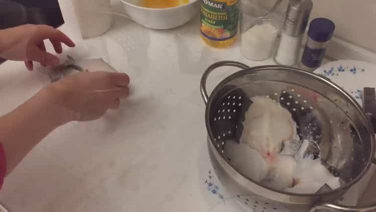To cook catfish steak in a pan, defrost the fish