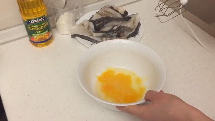 To prepare a catfish steak in a pan, prepare a batter