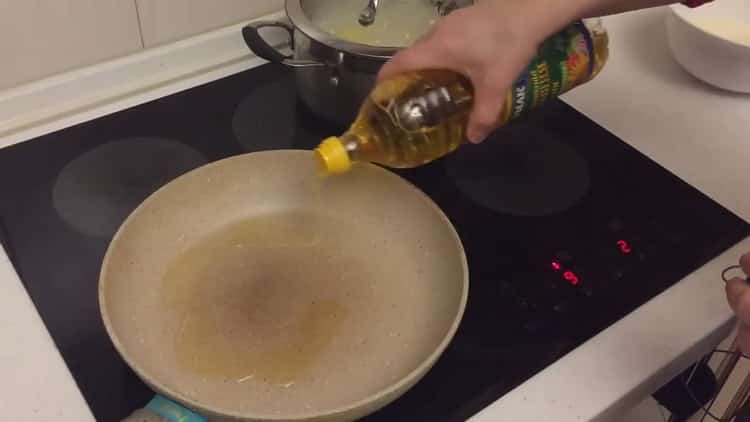 To cook catfish steak in a pan, heat the pan