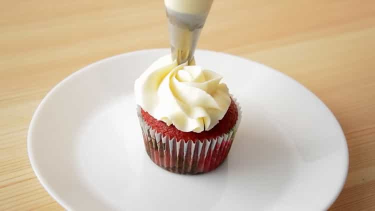 To make red velvet cupcakes, drop the cream on the cupcake