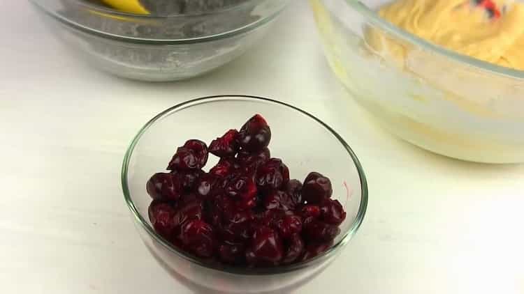 Prepare a cherry to make a muffin with poppy seeds