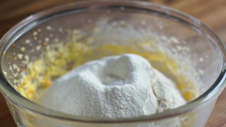 Sift the flour into a cake with candied fruit