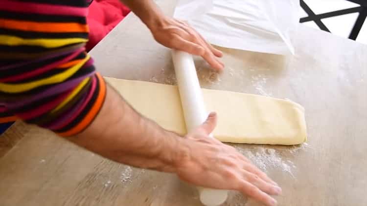 Roll the dough to make croissants