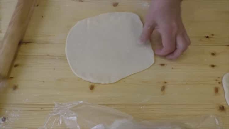 To make croissants with condensed milk, roll out the dough