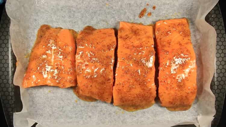 To cook salmon in a creamy sauce, preheat the oven