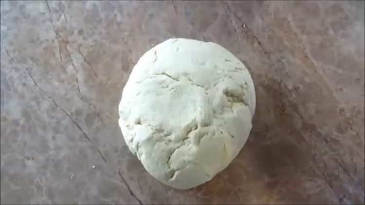 Knead the dough to make Mexican tortillas.