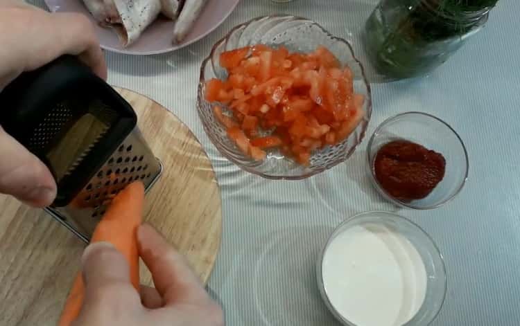 To cook pollock in a cream sauce, chop the carrots
