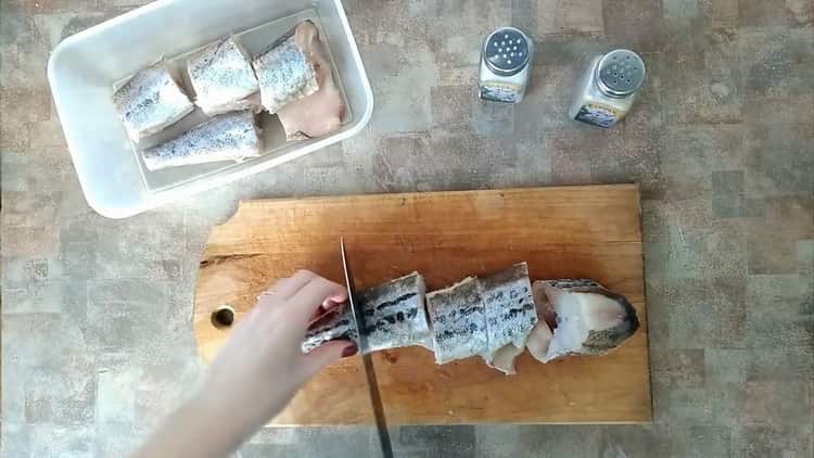 To cook pollock with vegetables, cut the fish