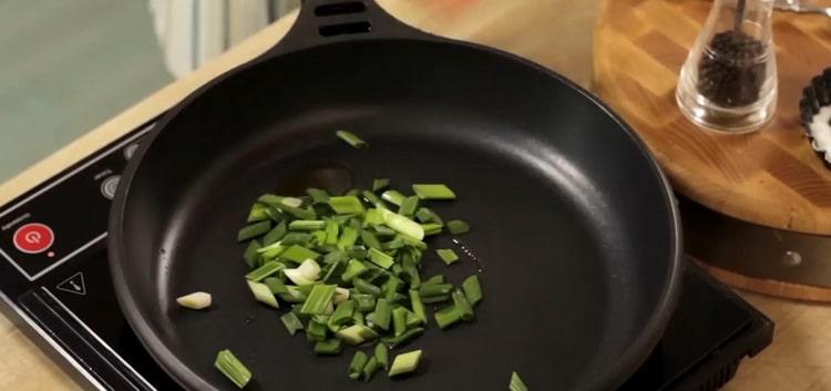 To cook salmon pasta, fry the onions