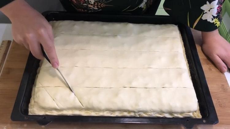 To make puff pastry baklava, cut the dough