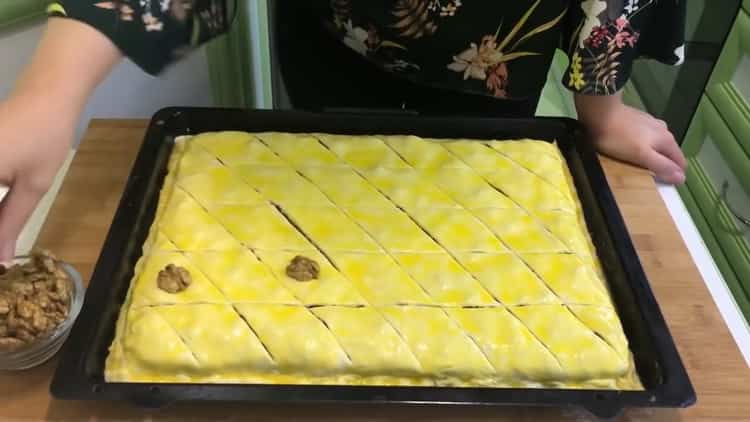 To make puff pastry baklava, grease the dough with an egg