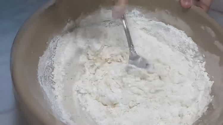 Mix the ingredients for sauerkraut pies.