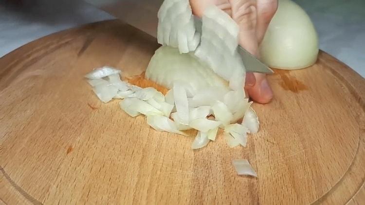 To make sauerkraut pies, chop the onion