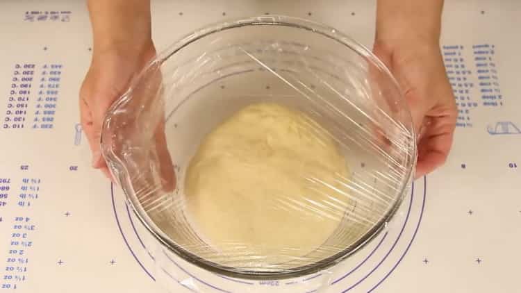 Knead the dough to make chicken pastries.