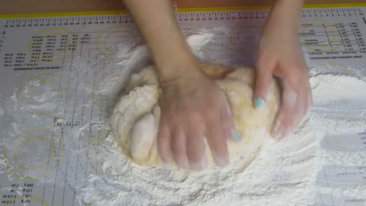 Knead dough to make carrot pies