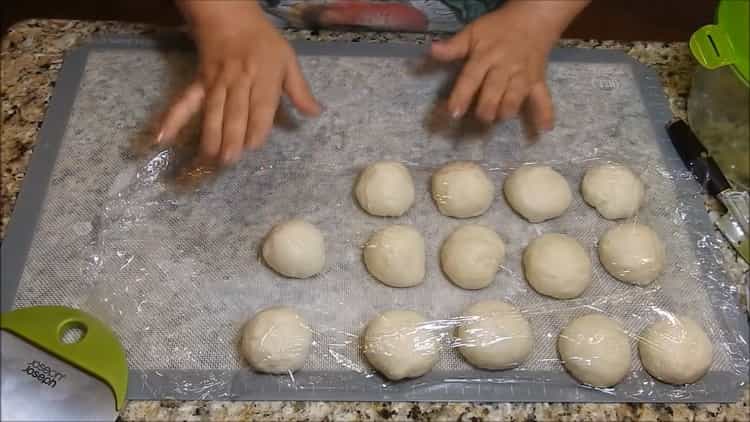 To prepare meat patties in the oven, place the dough under a film