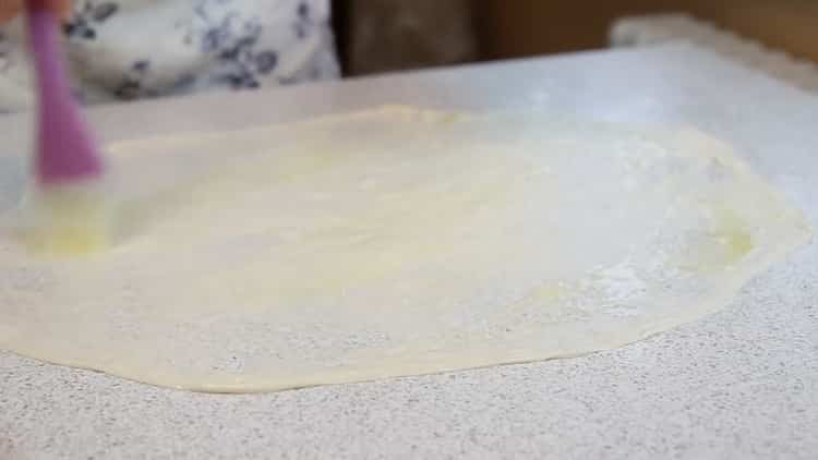 To make pies with meat from puff pastry, oil the dough