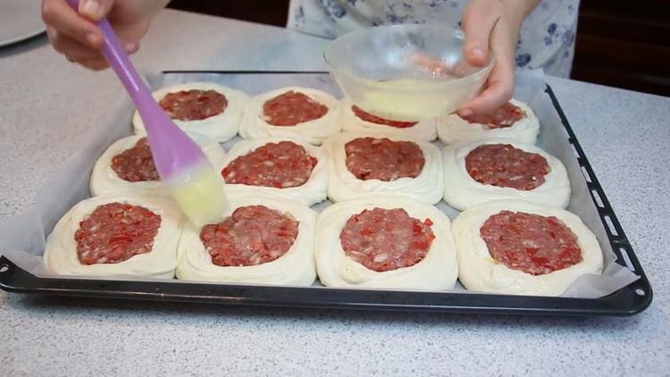 To cook puff pastry with meat, preheat the oven