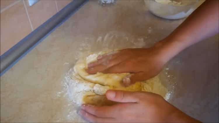 To make apple pies in the oven, knead the dough