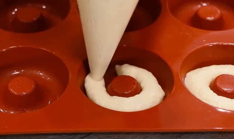 To make donuts in the oven, prepare a mold