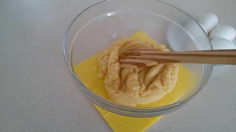 To make profiteroles with custard, add eggs to the dough