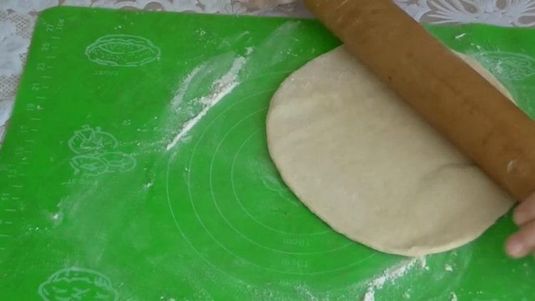 Roll dough to make bagels