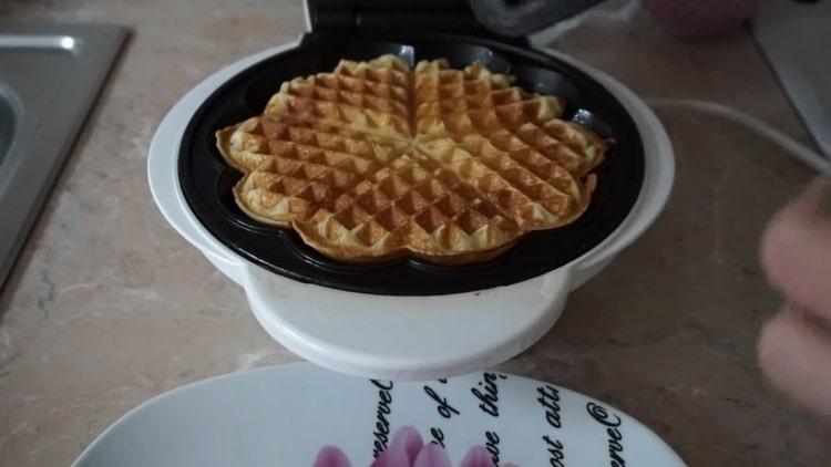 curd waffles in a waffle iron are ready