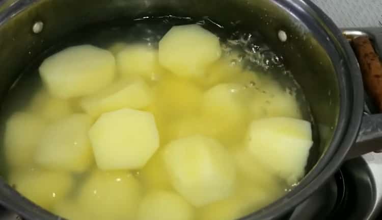 Boil potatoes to make a pie dough