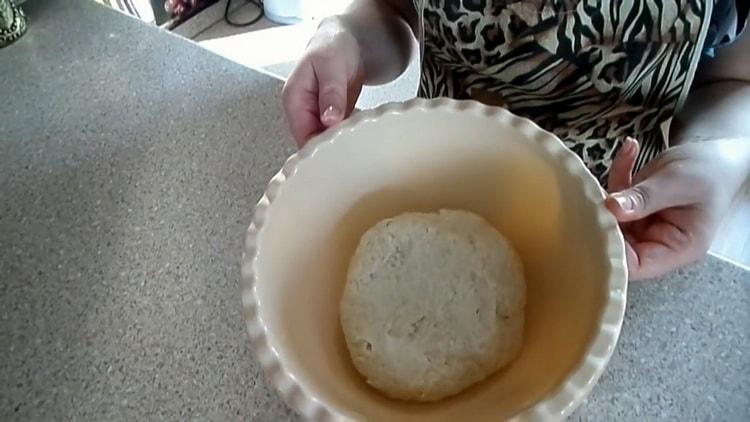 Knead the dough to make dough for pies with dry yeast.