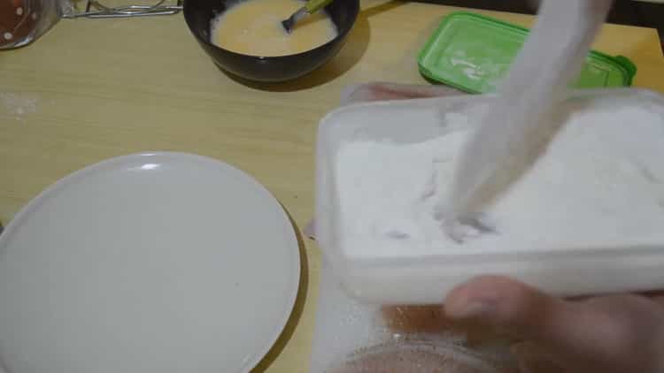Put fish in flour to make tilapia