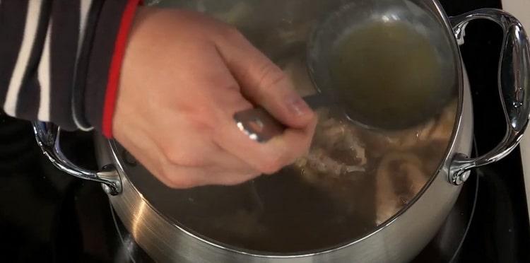 To prepare the sterlet fish soup, remove the foam