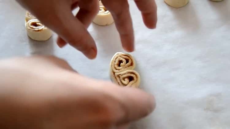 To prepare puff pastry ears, prepare a baking sheet