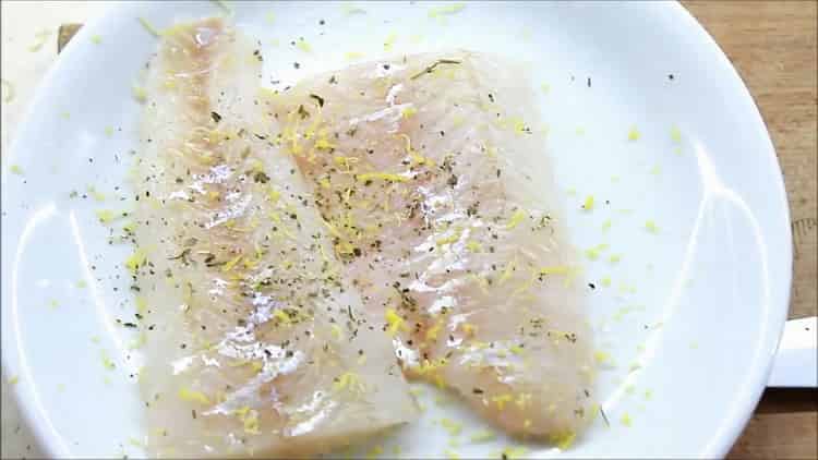 To prepare the pike perch fillet in the oven, sprinkle the fish with zest