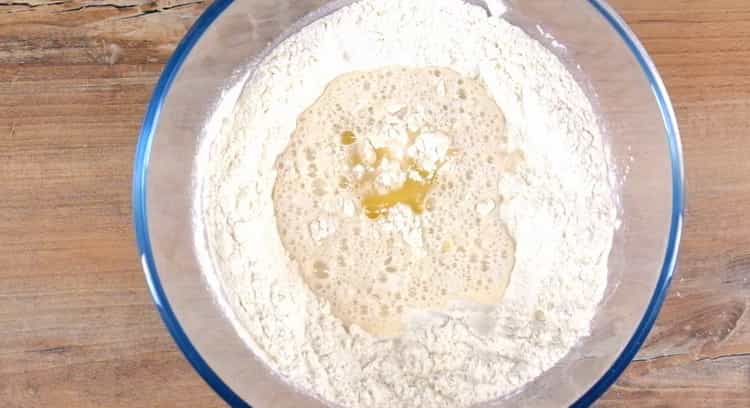 Mix the ingredients to make a khachapuri boat.