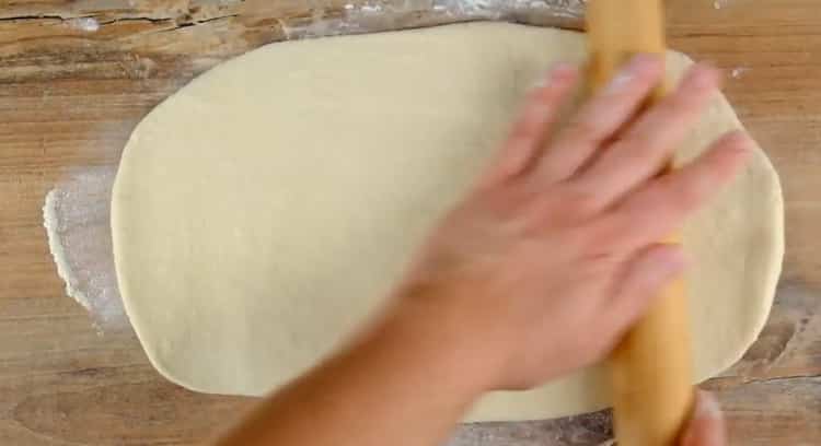 Roll out the dough to make a khachapuri boat