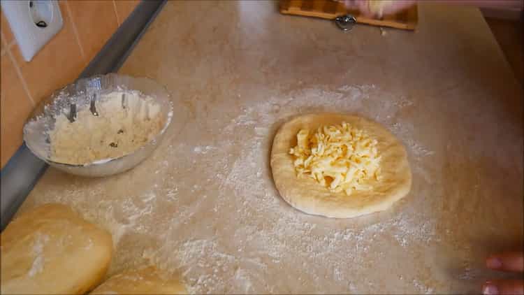 To make khachapuri in Georgian, put the cheese on the dough