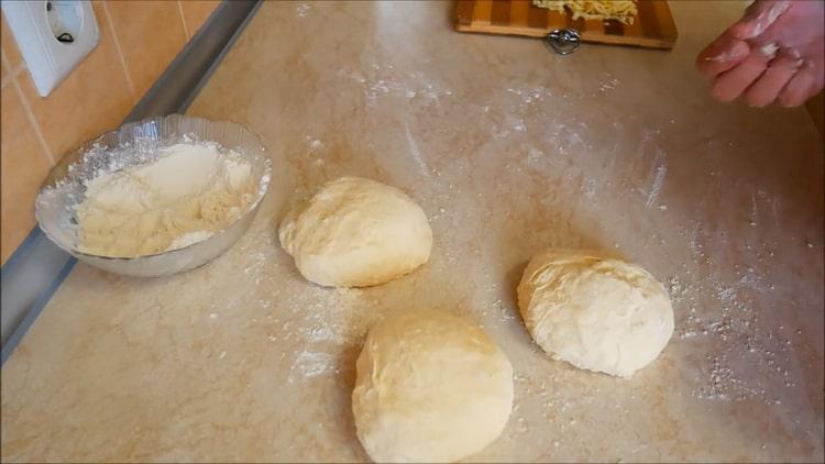 To prepare khachapuri in Georgian, divide the dough