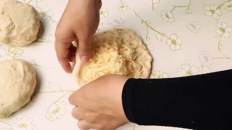 To prepare khachapuri, put the filling on the dough