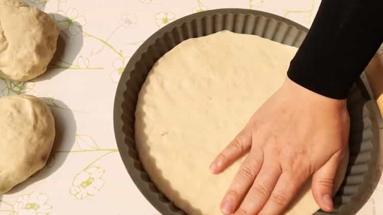 To make khachapuri, put the dough on a baking sheet