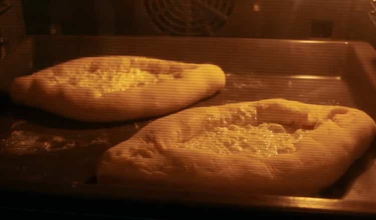 To cook khachapuri with egg and cheese, preheat the oven