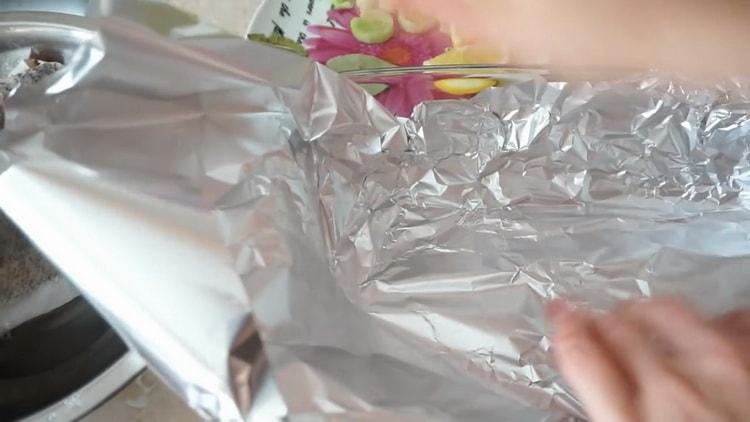 According to the recipe for cooking hake in the oven, lay out the foil