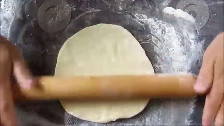 Roll the dough with the filling
